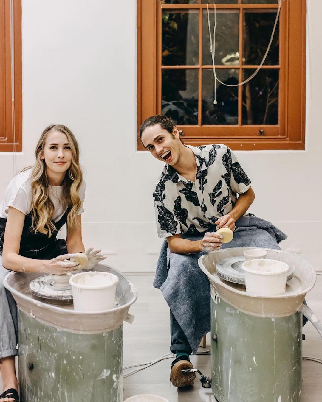 A couple at a pottery class, one of Perth's best date ideas