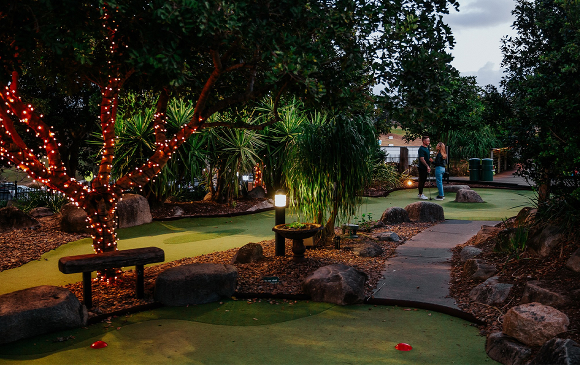a mini golf course at twilight