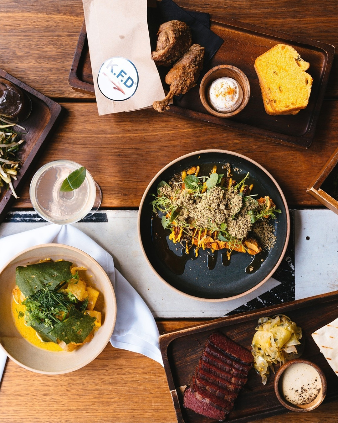 a table spread of food at brisbane's detour restaurant
