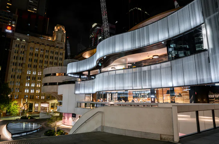 The glowing facade of the 25 Martin Place dining precinct in Sydney. 