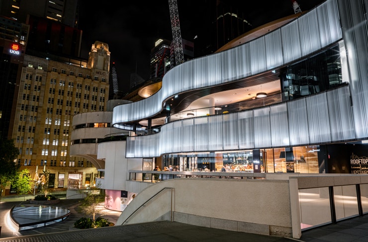 The glowing facade of the 25 Martin Place dining precinct in Sydney. 