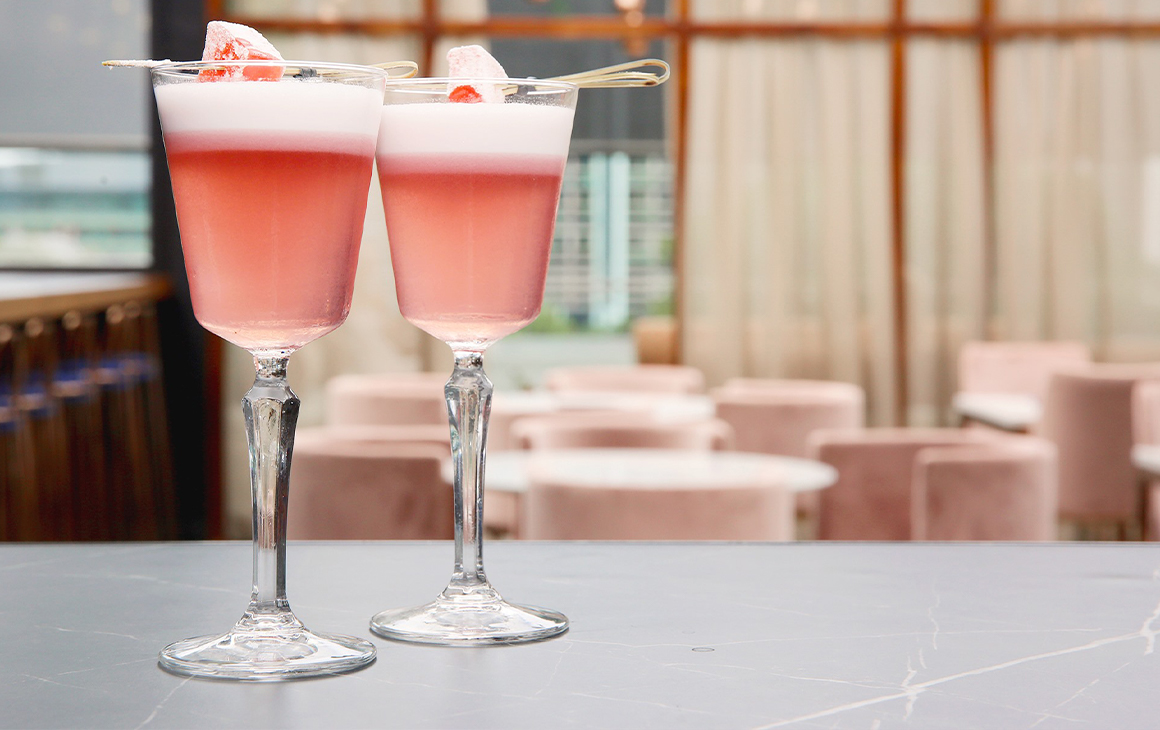Two pink cocktails topped with Turkish Delight
