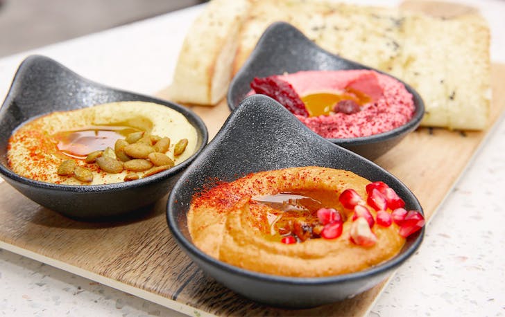 Three bowls of hummus