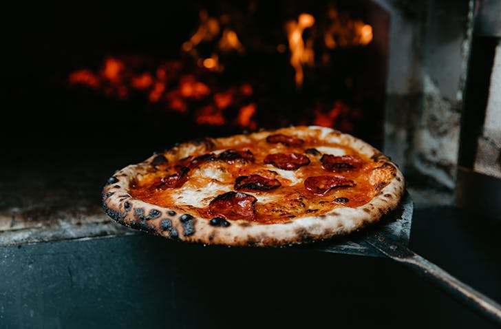 A best pizza melbourne coming out of an oven. 