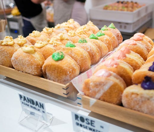 Rows of Donut Papito bombas, cream-filled doughnuts, on display at their Chippendale pop-up shop. 