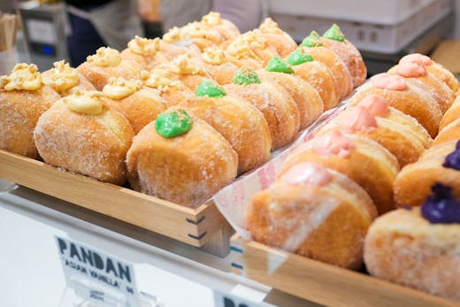 Rows of Donut Papito bombas, cream-filled doughnuts, on display at their Chippendale pop-up shop.