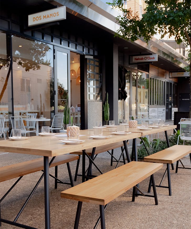 outdoor tables in front of the restaurant