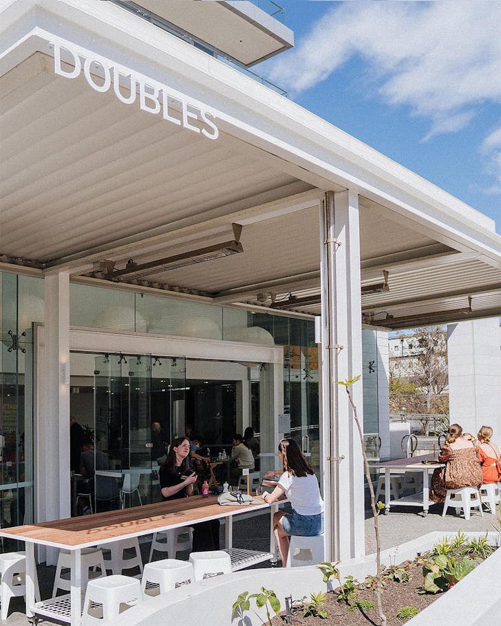 People sit outside Doubles cafe in Christchurch central.