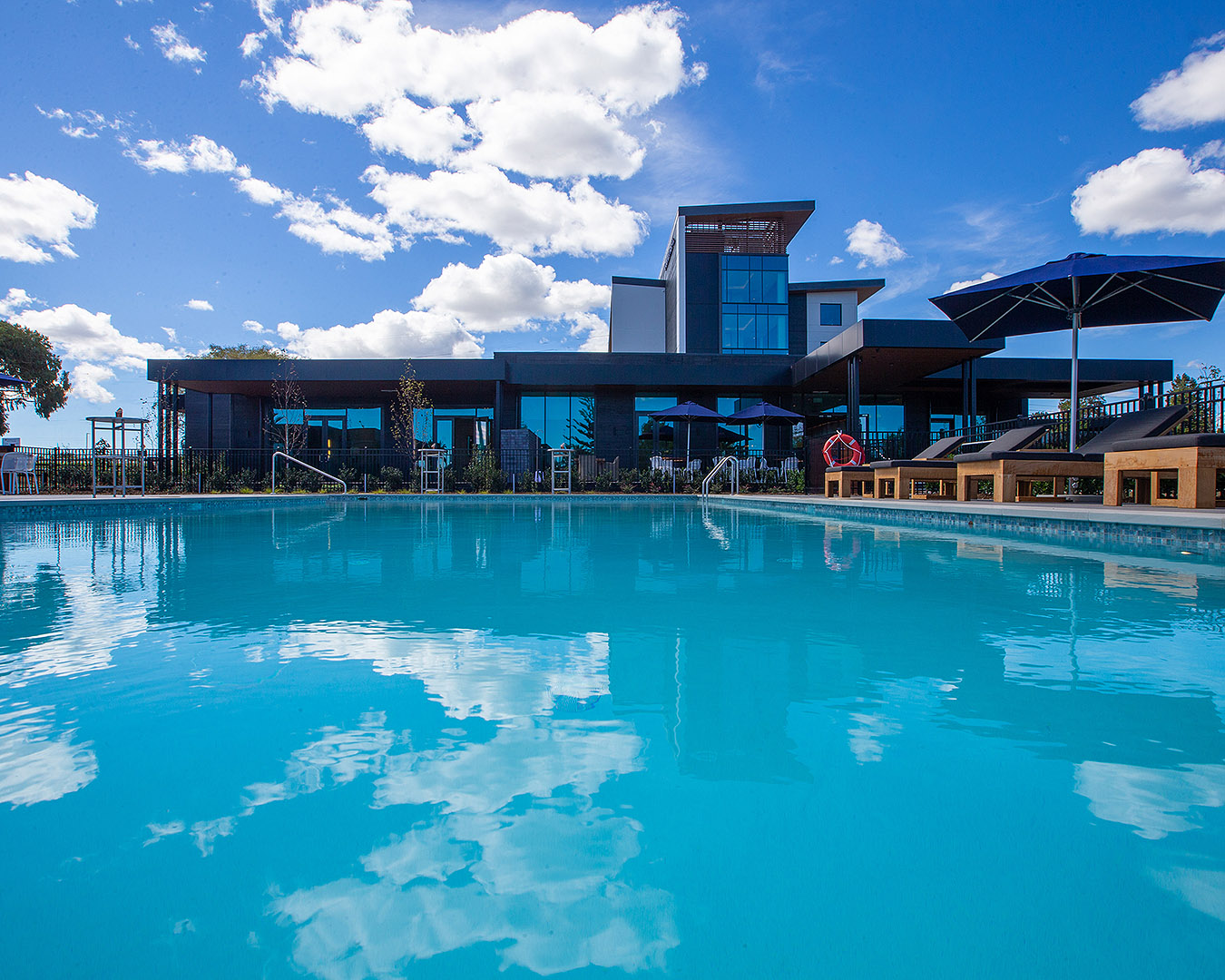 The pool and the exterior of the Doubletree by Hilton.