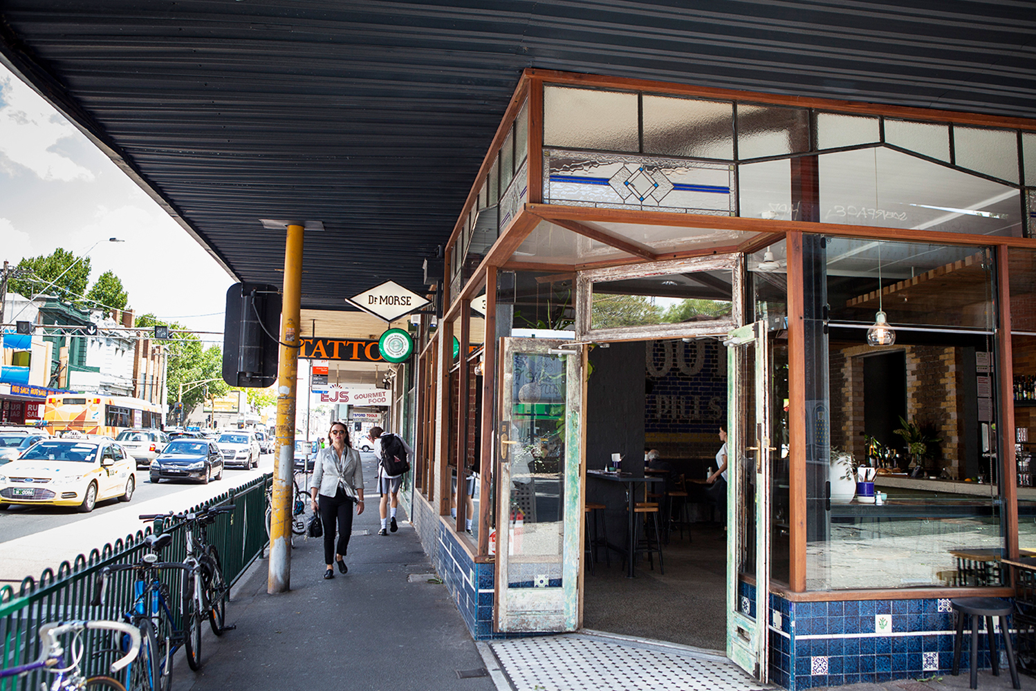 A streetview of one of the best bars of melbourne with its doors open. 