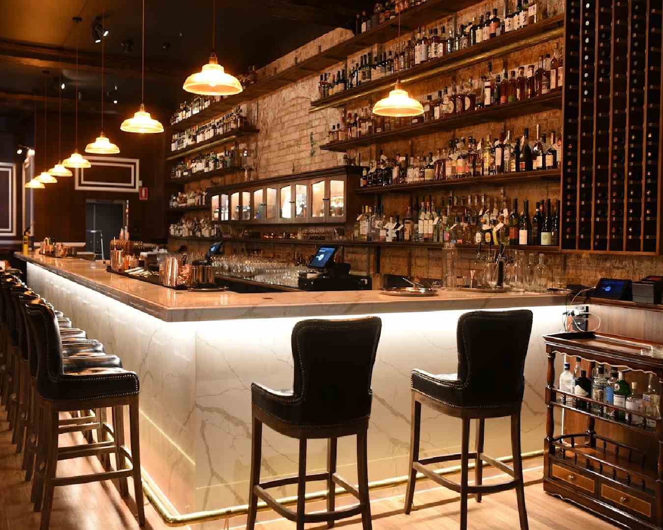 a long marble bar at brisbane cocktail bar Dr Gimlette