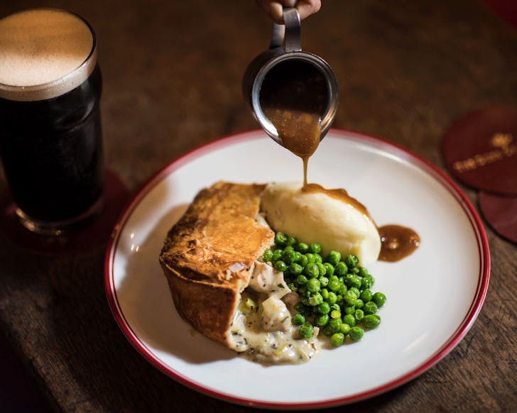 A pie with gravy and a pint of dark beer - Duke of Clarence