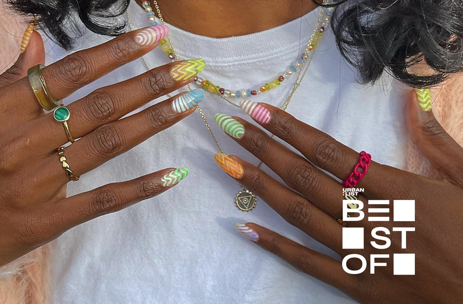 Someone holds up their gorgeous nails by Dune Nails, one of the best nail salons in Auckland.