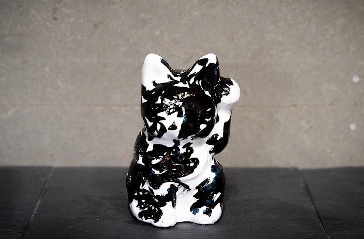 A contemporary black and white 'lucky cat' sculpture for DUO.