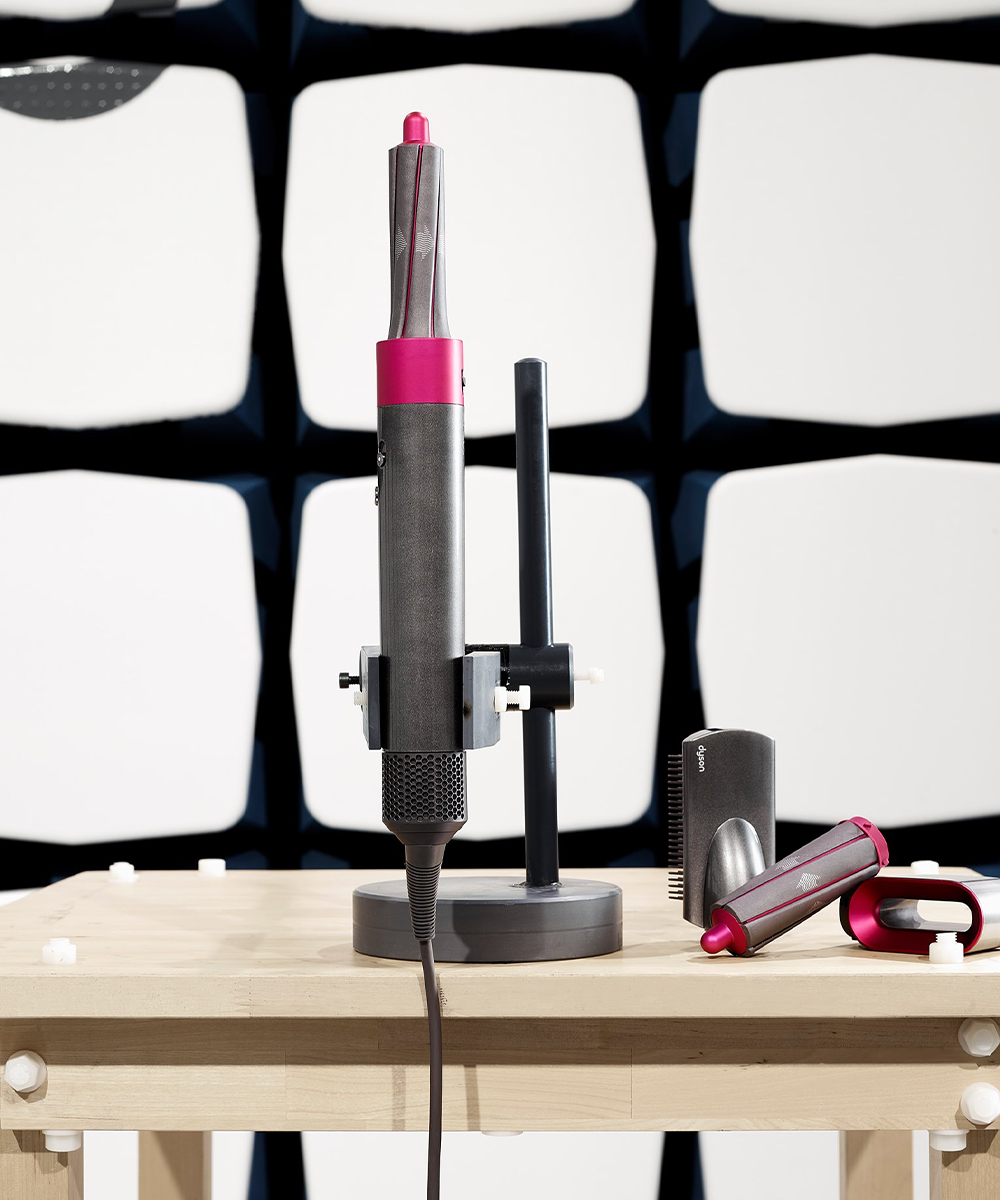 a dyson hair styler standing on a table