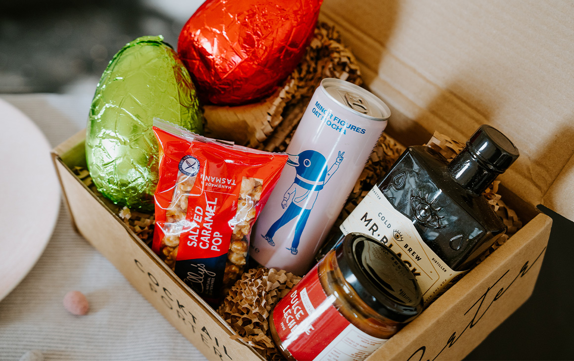 a box filled with easter eggs and cocktail ingredients