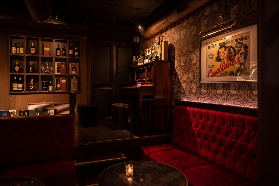 Dark bar with red chair
