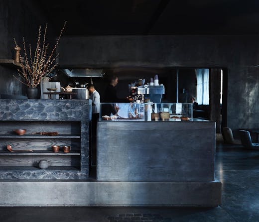 The sleek charcoal black interior of Edition Roasters cafe in Sydney