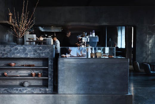 The sleek charcoal black interior of Edition Roasters cafe in Sydney