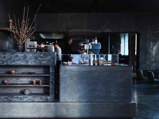 The sleek charcoal black interior of Edition Roasters cafe in Sydney