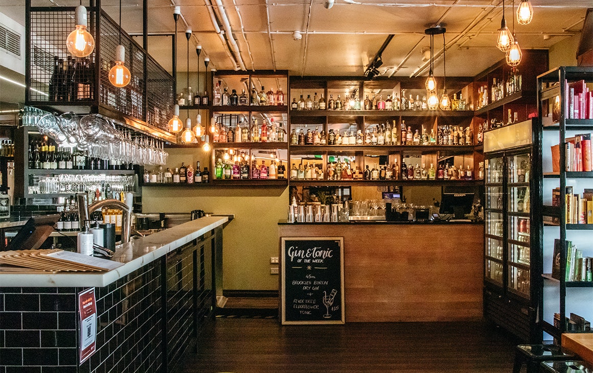 bar lined with bottles of gin