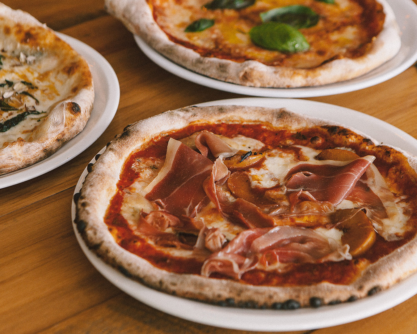 Pizzas on a table at ELMO's.