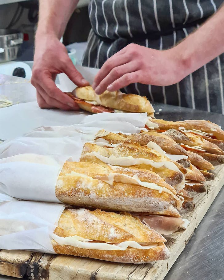 Someone preps ficelles at Elspeth Bakery,