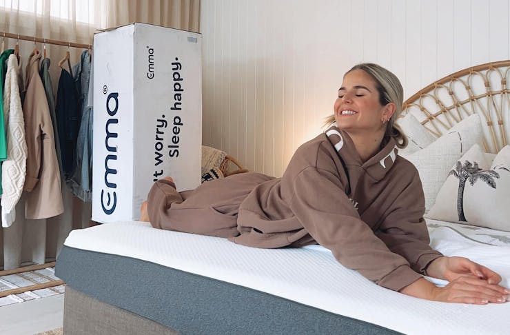 A person on an Emma Sleep mattress