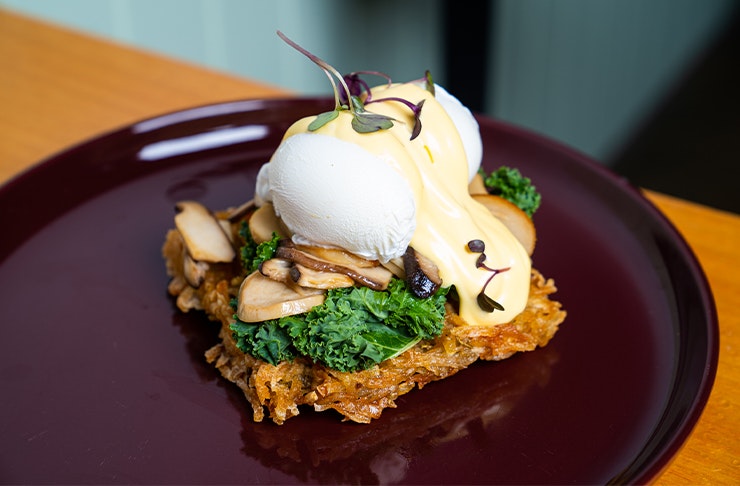 a plate of potato waffles with eggs