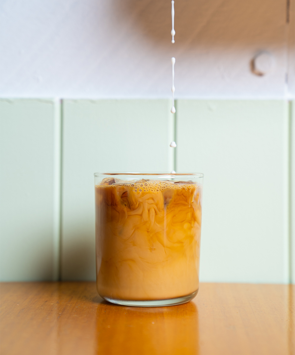 an iced coffee being poured