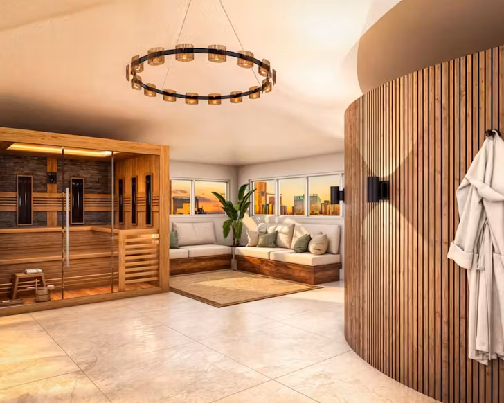 A room with a robe hanging, sauna, and skyline views in the background
