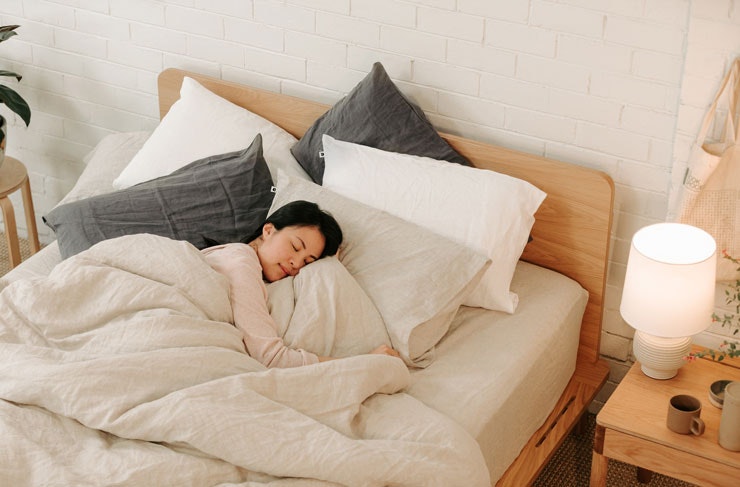 A woman sleeping on an Eva Mattress. 