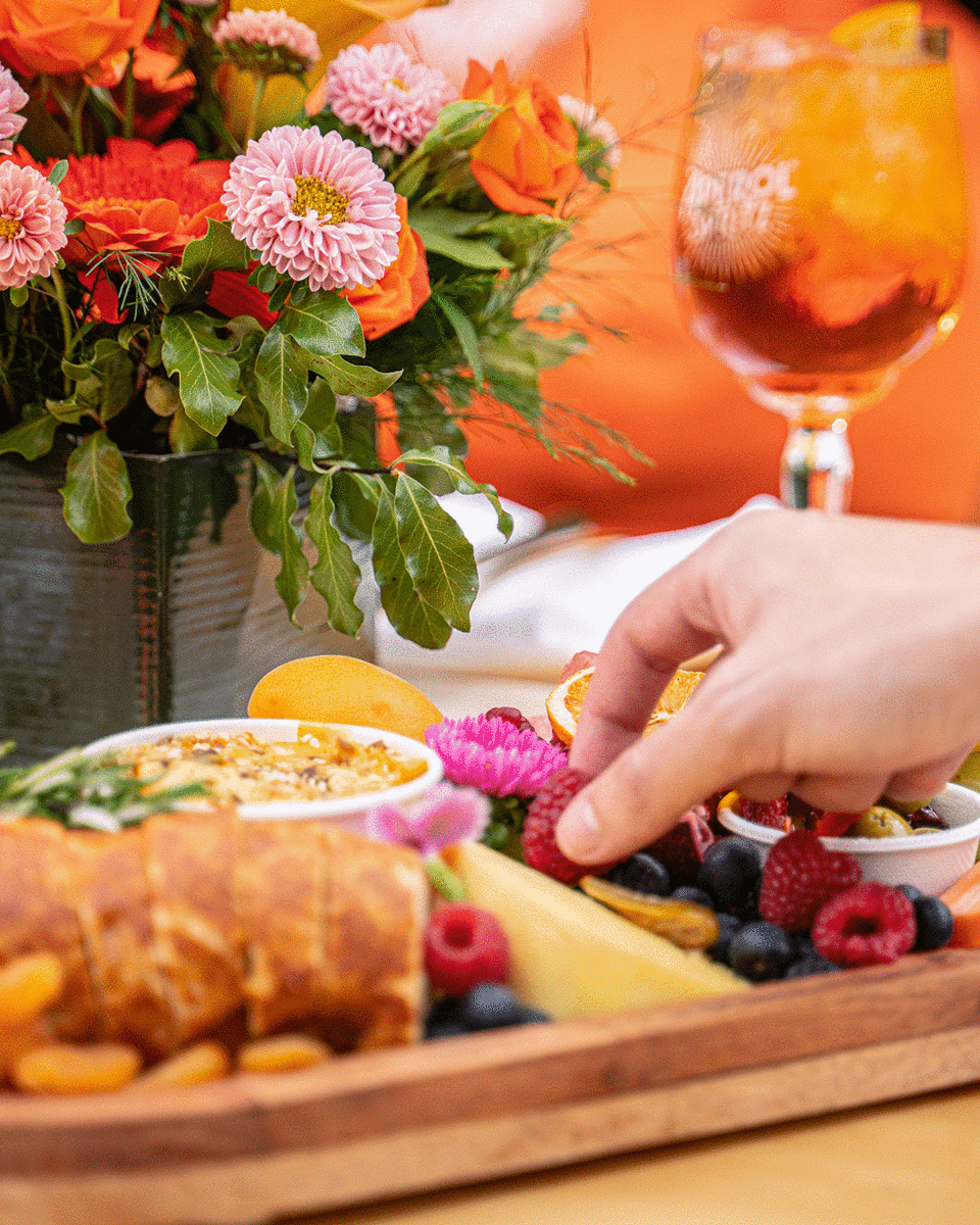 Details GIf Of Aperol's Pop-Up Picnic including Platters, Aperol Spritz, Ice Bucket And Decor