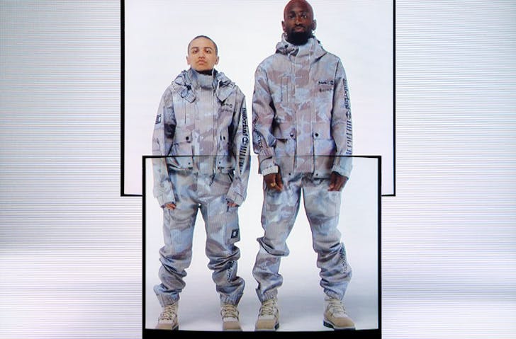 Model wearing camo looks from the Tommy Hilfiger x Timberland collection