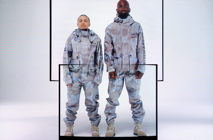 Model wearing camo looks from the Tommy Hilfiger x Timberland collection