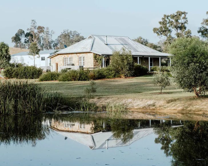 A view of Warramba farm stay with a lake at the front NSW