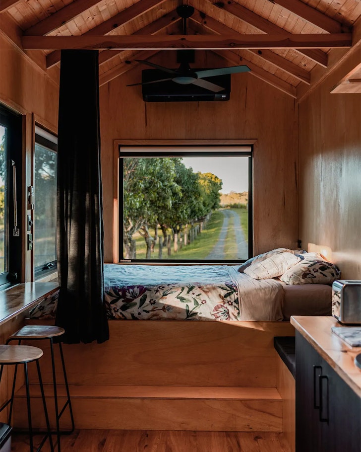The bed with a view at Tiny Farm House On The Hill one of the best farm stays near Brisbane