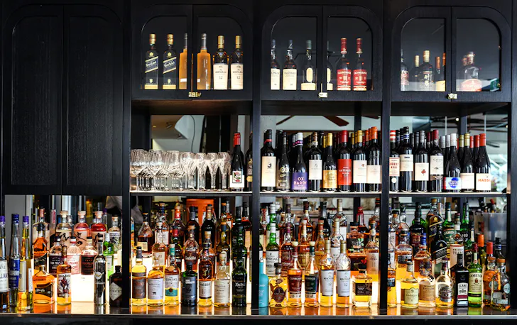 a black bar full of bottles