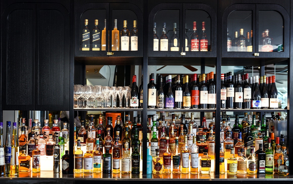 a black bar full of bottles