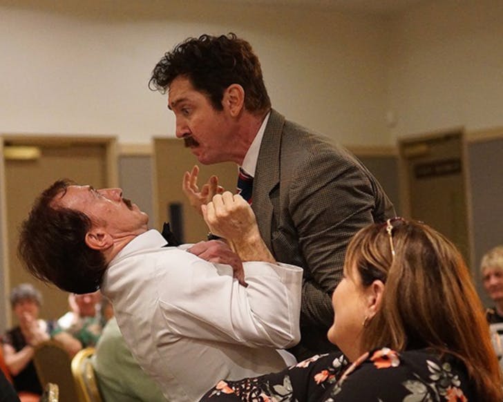 Faulty Towers The Dining Experience play out a scene in front of diners.