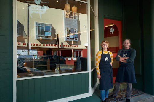 Laura Dalrymple and Grant Hilliard outside the painted green store front of Feather and Bone Waverley