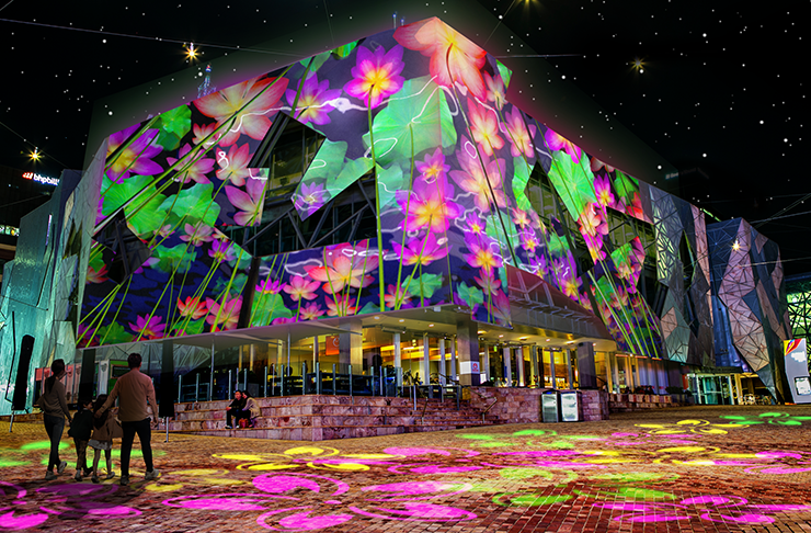 Fed Square illuminated at night.