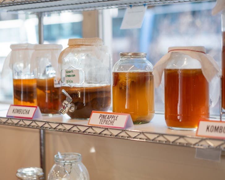 Jars of fermented foods on a shelf 
