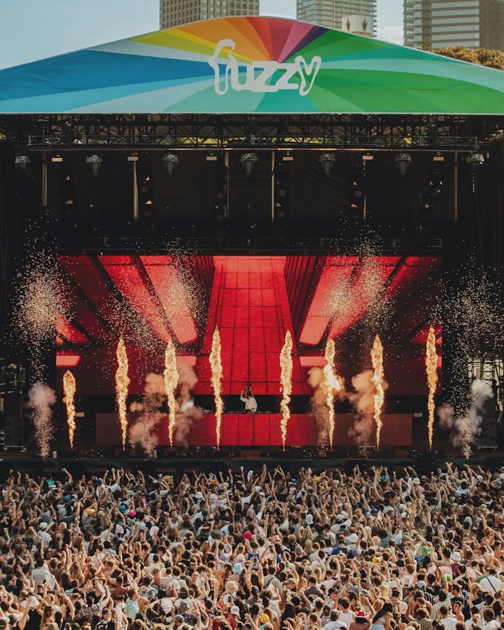 A DJ set at Field Day festival with a huge crowd and flame throwers