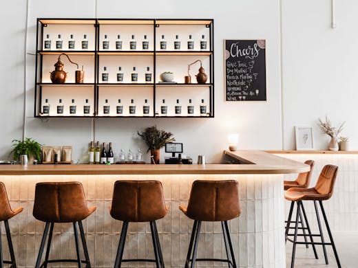 The white-tiled bar at Finders Distillery in North Sydney. 