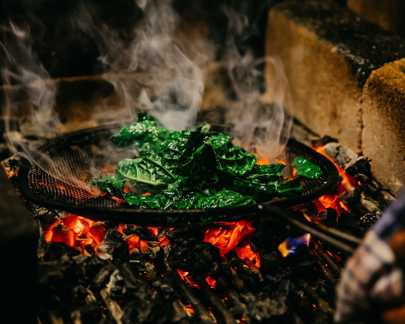 kale cooking over fire