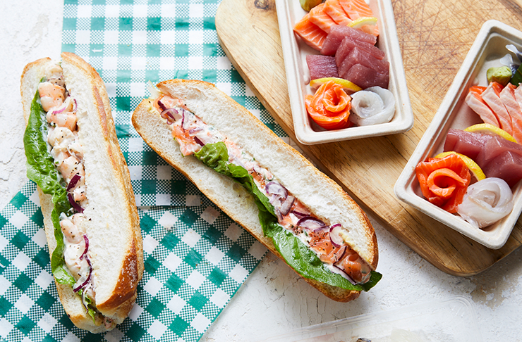 two prawn rolls on top of more sandwiches.