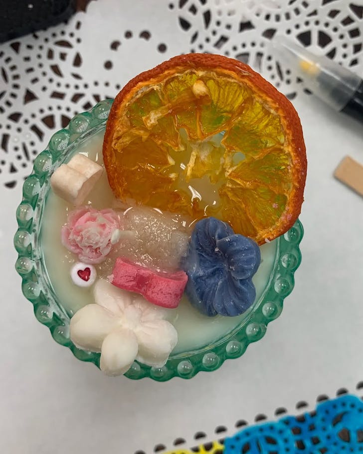 A hyper-real candle that looks like a cocktail.