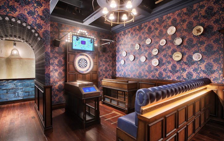a lounge area with darts board