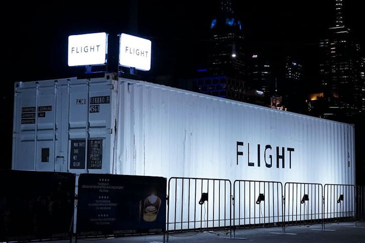 White shipping container with the word FLIGHT on the side